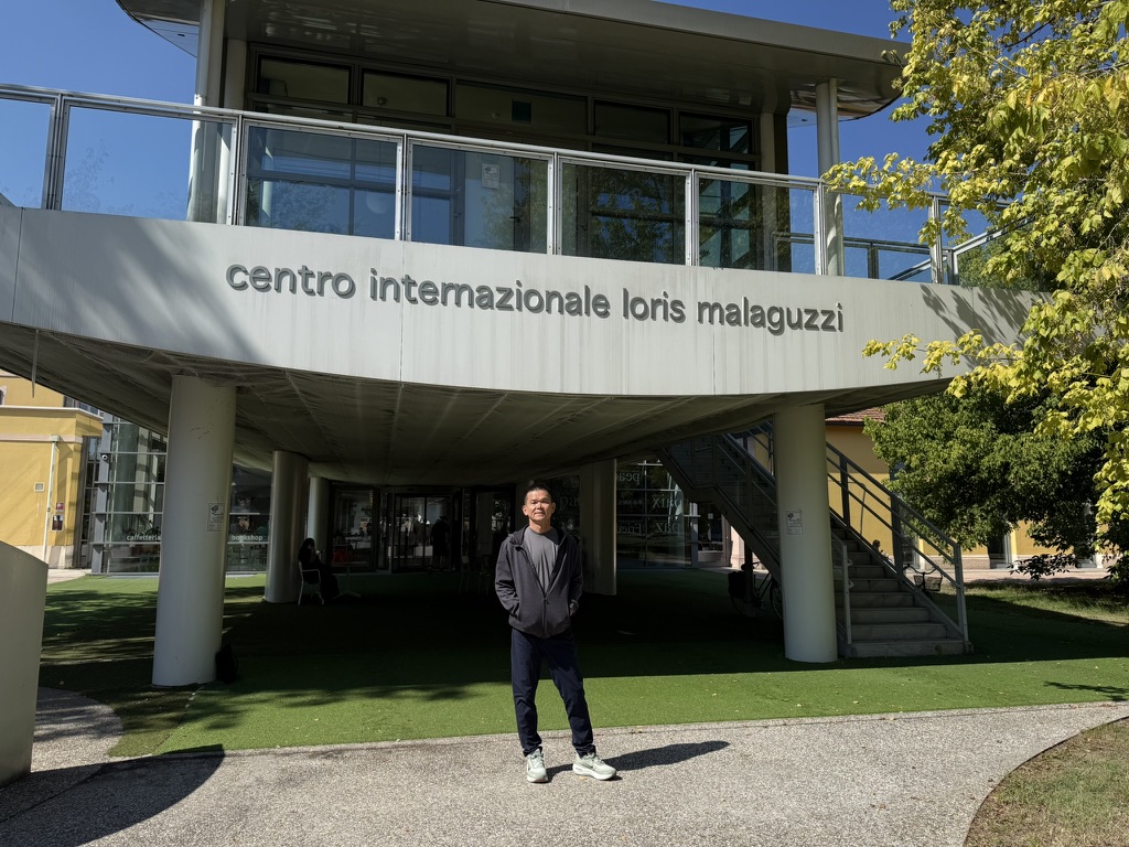 Simon Ho standing outside the Centro Internazionale Loris Malaguzzi in Reggio Emilia, Italy